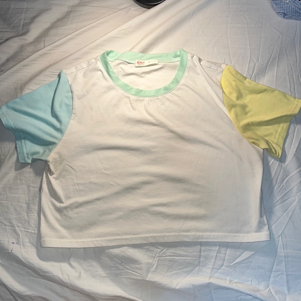 White crop from Romwe with green collar, one blue sleeve, and one yellow sleeve
